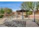 Relaxing backyard gazebo with seating area and landscaping at 9092 National Park Dr, Las Vegas, NV 89178