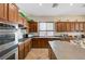 Kitchen with stainless steel appliances and dark wood cabinets at 9092 National Park Dr, Las Vegas, NV 89178