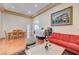 Living room with hardwood floors, comfy seating, and a view to dining area at 9092 National Park Dr, Las Vegas, NV 89178