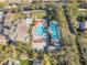 Resort-style community pool with lounge chairs, umbrellas, and lush landscaping at 921 Granger Farm Way, Las Vegas, NV 89145