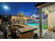 Outdoor kitchen, pool, and pergola at 10311 Sequoia Falls Pl, Las Vegas, NV 89149