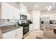 Modern kitchen with stainless steel appliances and granite countertops at 10311 Sequoia Falls Pl, Las Vegas, NV 89149