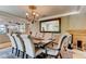 Formal dining room with a large table and chandelier at 128 Quail Run Rd, Henderson, NV 89014