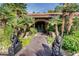 Elegant entryway with ornate iron doors and stone accents at 128 Quail Run Rd, Henderson, NV 89014