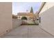 Large backyard with concrete patio and block wall at 2177 Mccartney Ct, Henderson, NV 89074