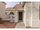 Front entryway with a dark brown door and white stucco walls at 2177 Mccartney Ct, Henderson, NV 89074