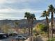 View of parking area with mountain backdrop and lush landscaping at 2191 Bay Club Dr # 202, Laughlin, NV 89029