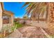 Small backyard with gravel, cactus, and block wall at 227 Gray Granite Ave, Las Vegas, NV 89123