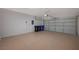 Two-car garage with light colored flooring and ample space for storage at 2603 Savannah Springs Ave, Henderson, NV 89052