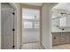 Hallway with view of bedroom and bathroom with double vanity at 2603 Savannah Springs Ave, Henderson, NV 89052