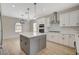 Modern kitchen with island, double oven, and stainless steel appliances at 2603 Savannah Springs Ave, Henderson, NV 89052