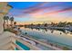 Stunning view of the lake with boats and palm trees at 2941 Harbor Cove Dr, Las Vegas, NV 89128