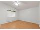 Spacious bedroom with light walls, ceiling fan and bamboo flooring at 6657 Diamond Care Dr, Las Vegas, NV 89122