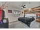 King-size bed, ceiling fan, and rustic wood wall in this large bedroom at 713 Antelope Way, Las Vegas, NV 89145