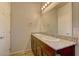 Bathroom with double vanity, granite countertop, and large mirror at 7530 Cooks Meadow St, North Las Vegas, NV 89084