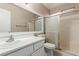 Bathroom with shower, vanity, and mirror at 7556 Kalmalii Ave, Las Vegas, NV 89147