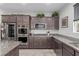 Modern kitchen with stainless steel appliances and granite countertops at 8044 Mercury Skye St, Las Vegas, NV 89166