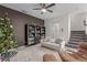 Living room with a Christmas tree, built-in shelving, and a view of the stairs at 8044 Mercury Skye St, Las Vegas, NV 89166