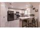 Modern kitchen with stainless steel appliances and gray cabinets at 8516 Spyrun Dr, Las Vegas, NV 89134