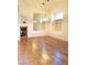 Bright dining room features wood-look floors and a large mirror at 9728 Echo Hills Dr, Las Vegas, NV 89134