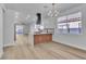 Modern kitchen with island, quartz countertops, and stainless steel appliances at 10200 Wood Work Ln, Las Vegas, NV 89135