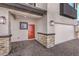 Front entrance with red door, stone accents, and brick pavers at 1053 Gentle Swan St # 676, Henderson, NV 89011