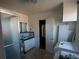 Bathroom with shower, sink, and washer/dryer at 1116 E Owens Ave, North Las Vegas, NV 89030