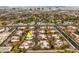 Aerial view of townhouses with a community pool and the Las Vegas Strip in the background at 2465 El Paseo Cir, Las Vegas, NV 89121