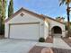 Single story home with a two-car garage and walkway at 3232 Shoreheight St, Las Vegas, NV 89117