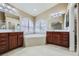 Elegant bathroom with double vanity and soaking tub at 3732 Via Di Girolamo Ave, Henderson, NV 89052