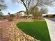 Landscaped area with a large tree and rock border at 3732 Via Di Girolamo Ave, Henderson, NV 89052