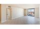 Living room with tile floors and sliding glass doors to balcony at 3930 University Center Dr # 1003, Las Vegas, NV 89119