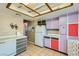 Kitchen features white appliances and purple cabinets at 4224 Timpani Dr, Las Vegas, NV 89110