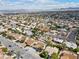 Aerial view of neighborhood, showcasing a house with a pool at 4431 El Campana Way, Las Vegas, NV 89121