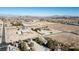 Aerial view showing a house situated on a large lot, with a view of the city in the distance at 5425 W Meranto Ave, Las Vegas, NV 89139