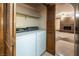 Laundry room with washer, dryer, and built-in shelving at 5425 W Meranto Ave, Las Vegas, NV 89139