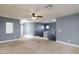 Large bedroom with ceiling fan and neutral walls at 5843 Aimless St, Henderson, NV 89011