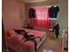 Bedroom with a bed, red checkered curtains, and tile flooring at 6545 Casada Way, Las Vegas, NV 89107