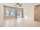 Living room with tile floors and sliding glass doors at 6989 Florido Rd, Las Vegas, NV 89178