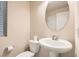 Clean powder room with pedestal sink and toilet at 6989 Florido Rd, Las Vegas, NV 89178