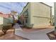 Exterior view of the apartment building with a walkway, landscaping, and balconies at 7078 Burcot Ave # B15, Las Vegas, NV 89156