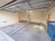 Attached garage with open door, concrete floor and ladder at 9013 Progressive Ct, Las Vegas, NV 89149