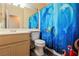 Full bathroom with tub, toilet, and updated flooring at 911 Rifle Dr, Henderson, NV 89002