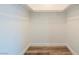 Large walk-in closet with wood-look floors and shelving at 911 Rifle Dr, Henderson, NV 89002