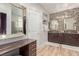 Luxurious primary bathroom with dual vanities, a vanity area, and modern fixtures at 952 Mckinley View Ave, Henderson, NV 89012