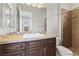 Bathroom with tiled shower, vanity, and toilet at 10032 Emerald Pools St, Las Vegas, NV 89178