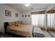 Bedroom with a large bed, mirrored closet doors, and soft, neutral-toned decor at 10078 Heron Island Ave, Las Vegas, NV 89148