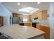 Kitchen with wood cabinets, stainless steel appliances, and tile countertops at 10078 Heron Island Ave, Las Vegas, NV 89148