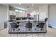 Modern kitchen island with black countertop and breakfast bar seating at 10154 Prattville Ave, Las Vegas, NV 89148