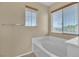 Relaxing bathtub with large window views at 11045 Village Ridge Ln, Las Vegas, NV 89135